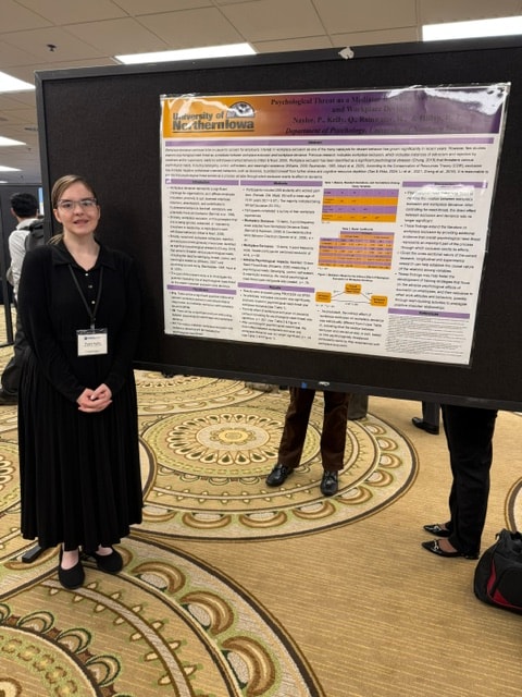 PNE Lab student presenting research poster at the Midwestern Psychological Association conference, Chicago, April 2026