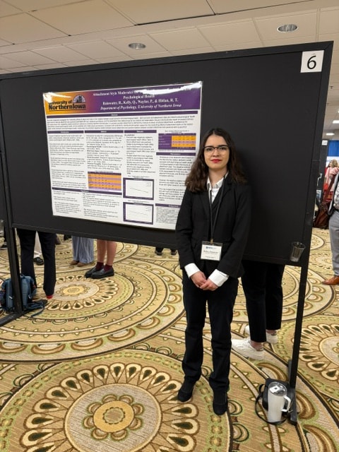 PNE Lab student presenting research poster at the Midwestern Psychological Association conference, Chicago, April 2026